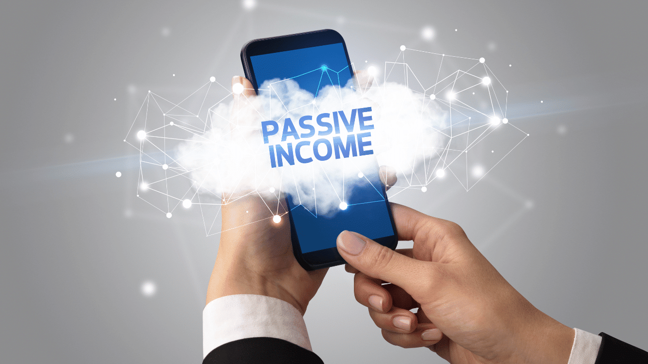 Hand holding smartphone displaying passive income.